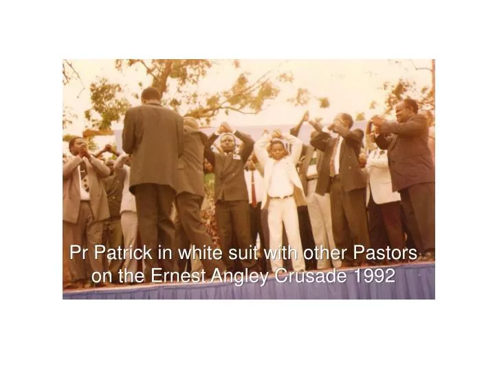 pr patrick in white suit with other pastors on the ernest angley crusade 1992